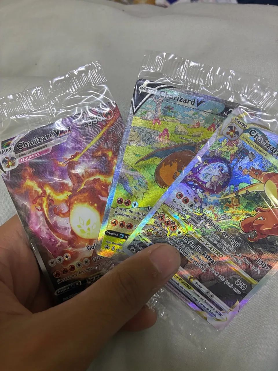 Trio charizard em estado M