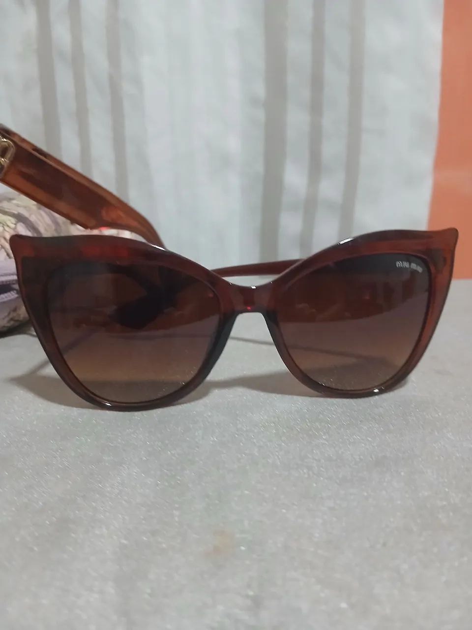 Óculos de sol novos e relógio 40 reais - Foto 3