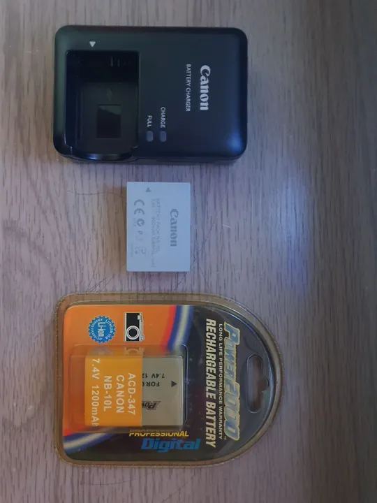 COMBO : CARREGADOR CANON + BATERIA CANON ÷ BATERIA EXTRA LACRADA