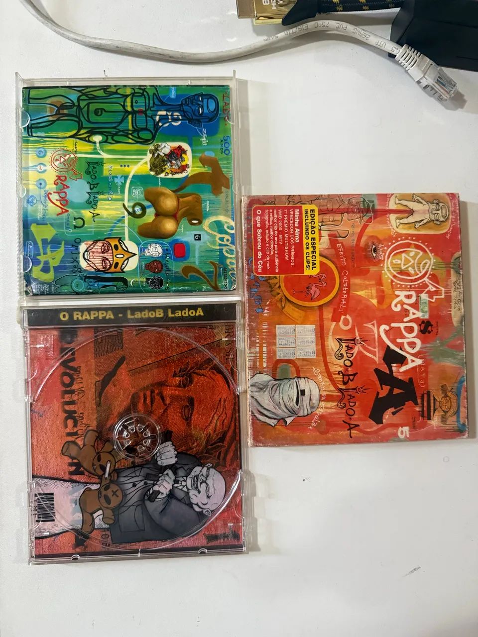 Capa e encarte do cd o rappa lado b lado a - Foto 3