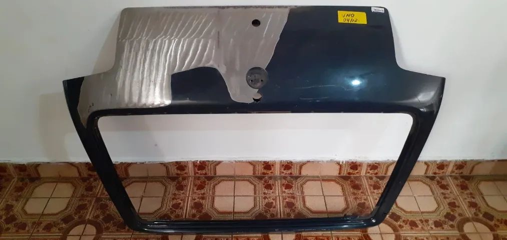 Tampa traseira Fiat Uno Original Usada (pit bull).  - Foto 4