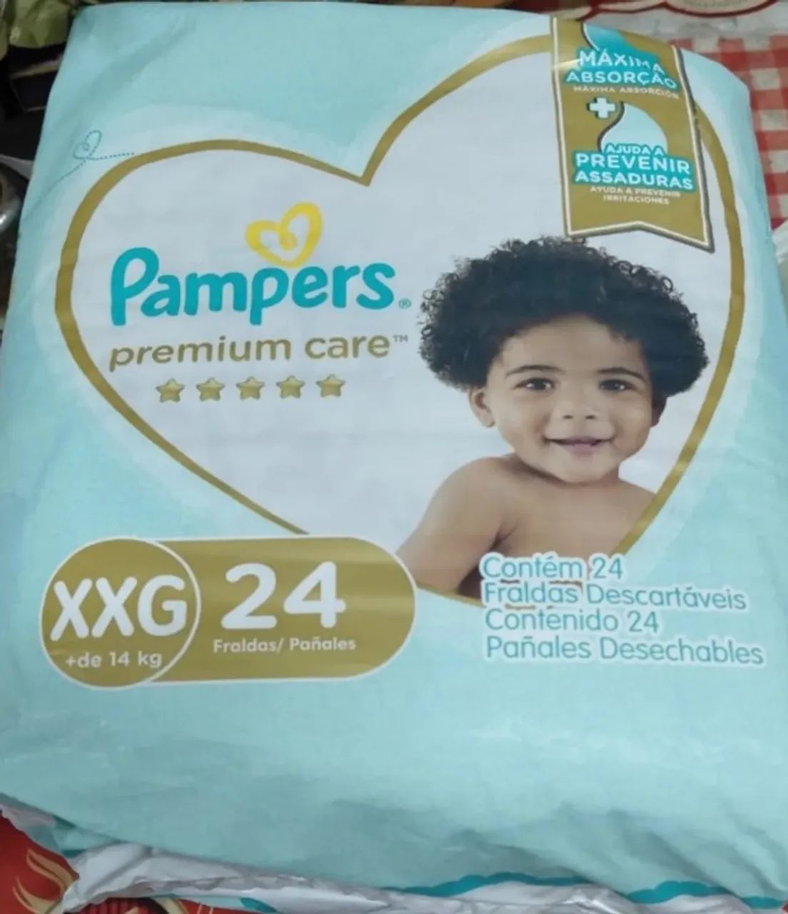 Fralda pampers premium care xxg