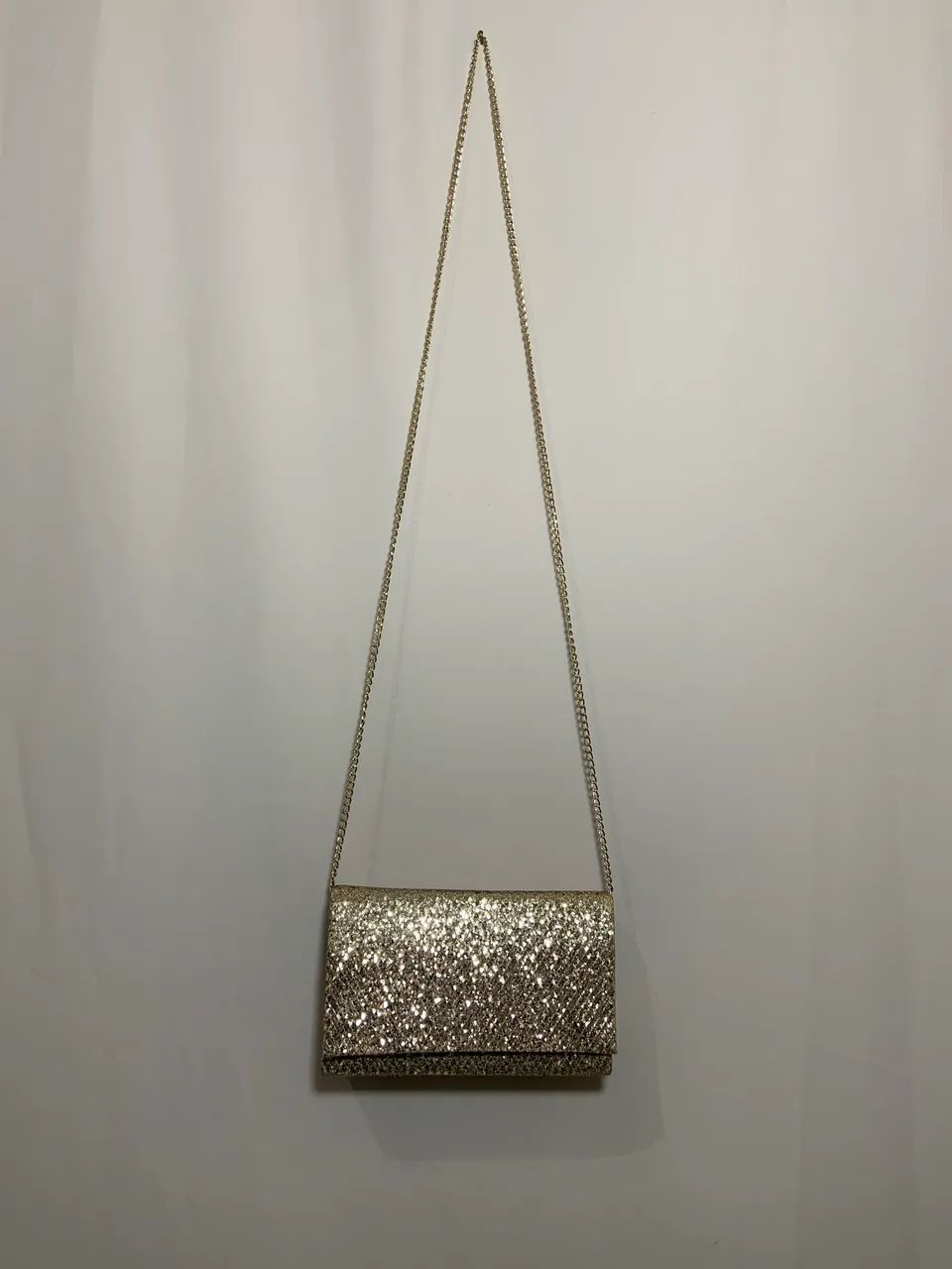 Bolsa clutch brilhosa dourada 
