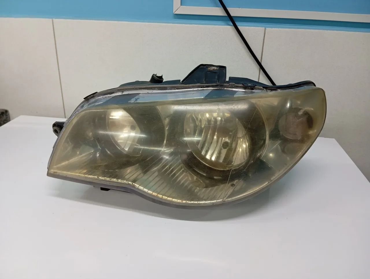 Farol Lado esquerdo Strada 