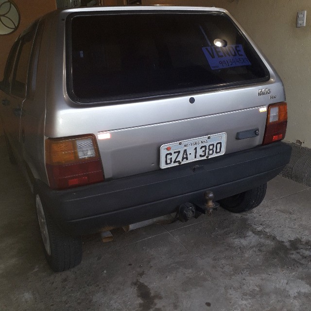 FIAT/UNO MILLE FIRE ANO 2002, COR CINZA, EM ÓTIMO ESTADO DE CONSERVAÇÃO.