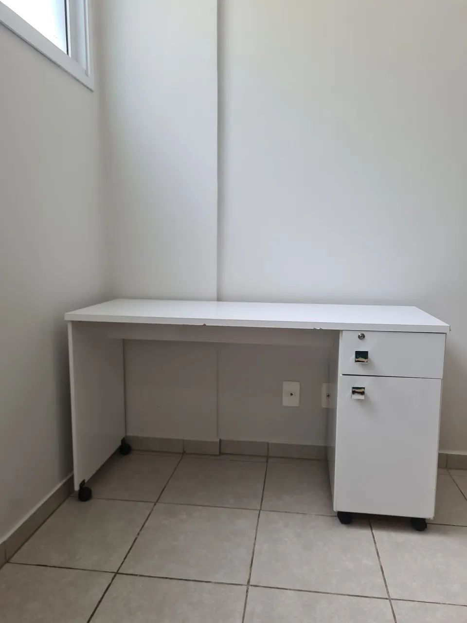 Study desk with drawer, door, and casters