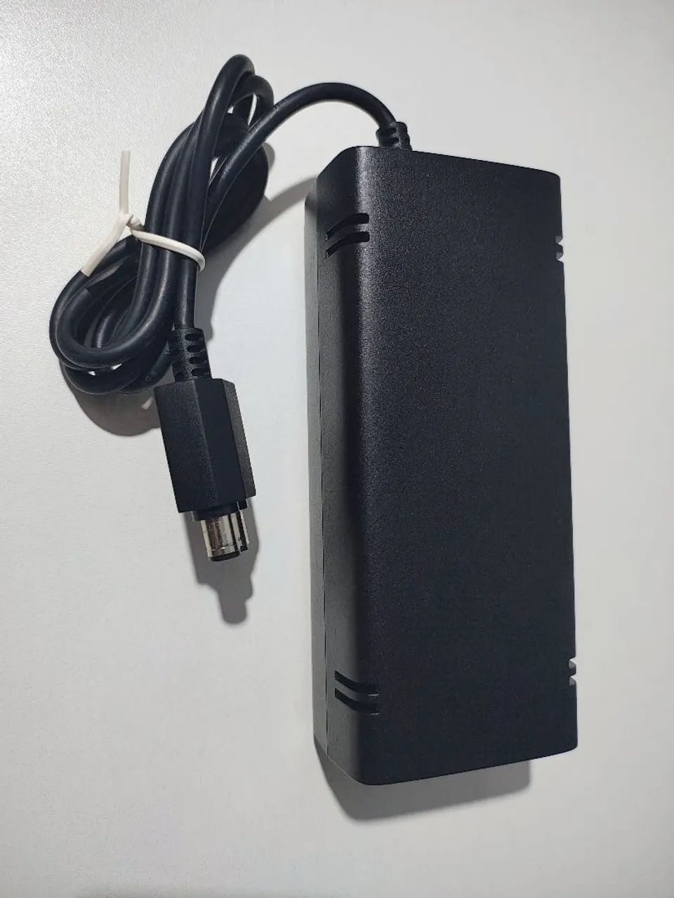 Fonte original para Xbox 360 Slim 110v