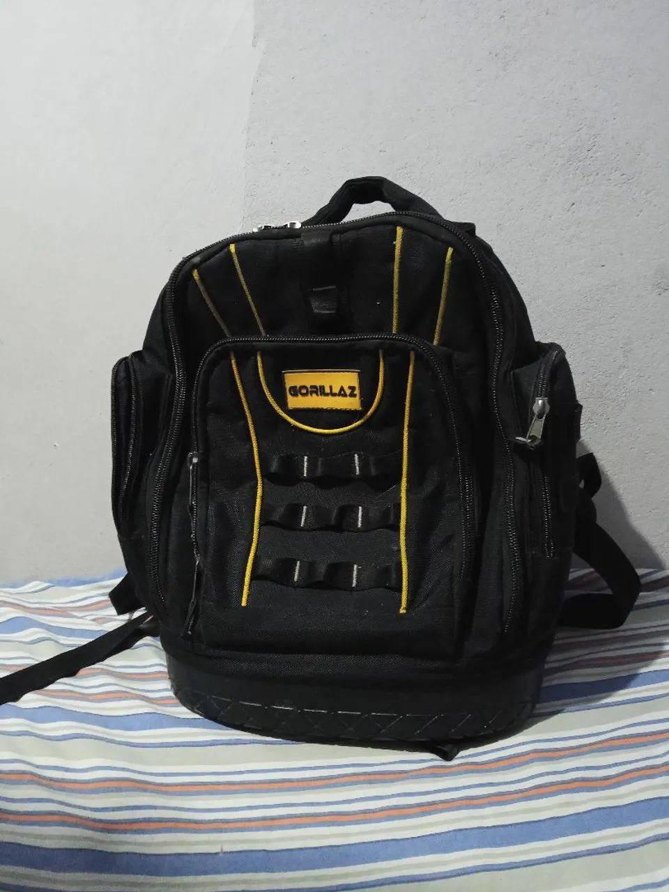 Mochila de ferramentas com defeito 