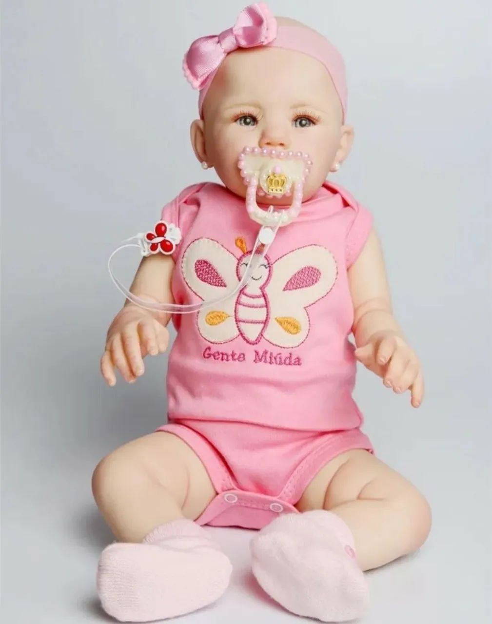 Boneca bebê reborn de silicone com brinco 48 cm - Foto 2