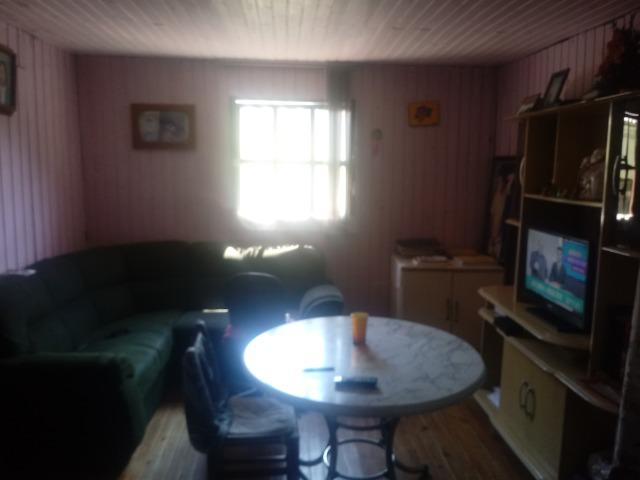Venda de terreno com casa de madeira - Foto 6