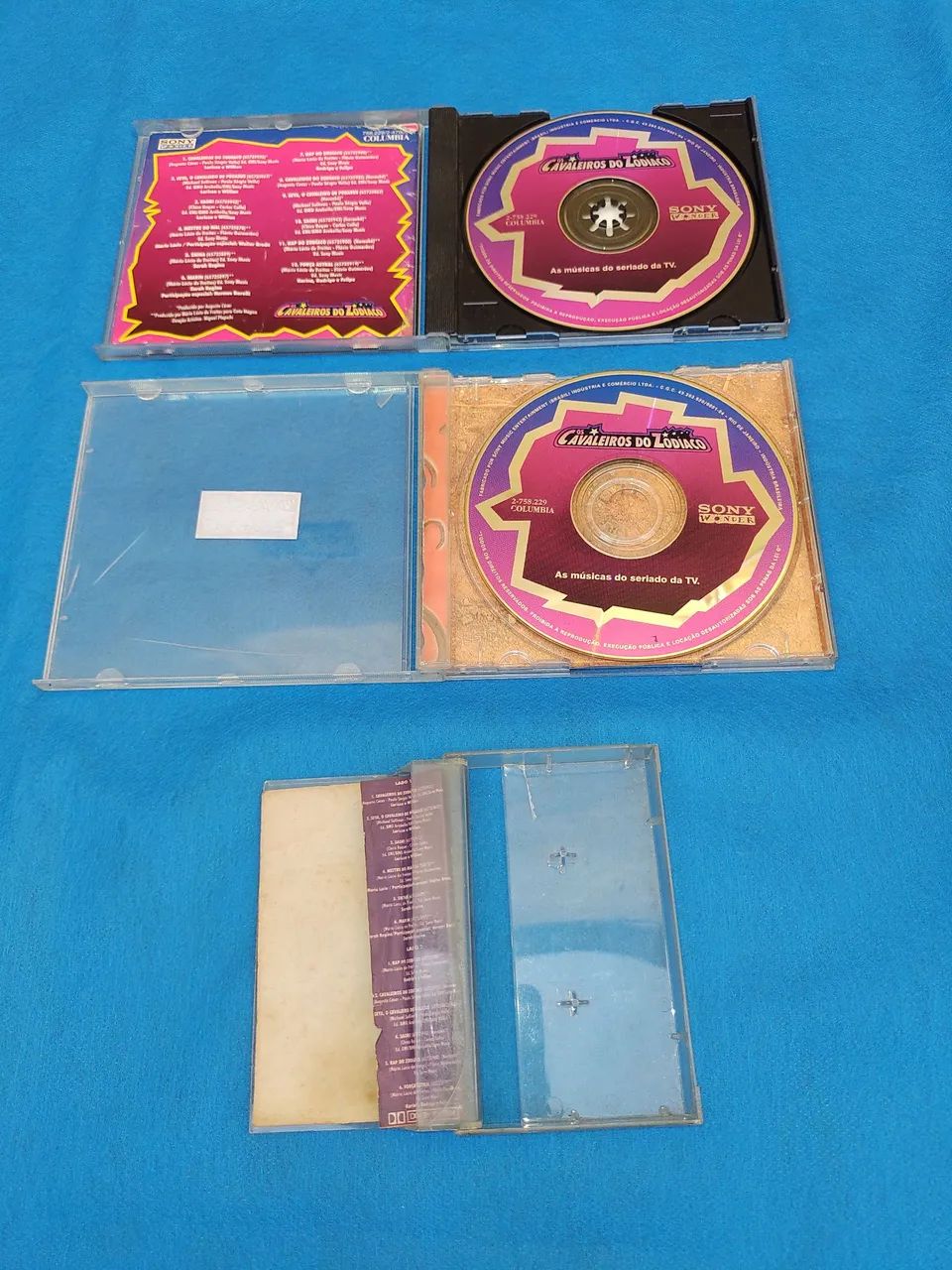 Lote itens dos Cavaleiros do Zodíaco, com 1Dvd + 1Cd + 1fita Vhs