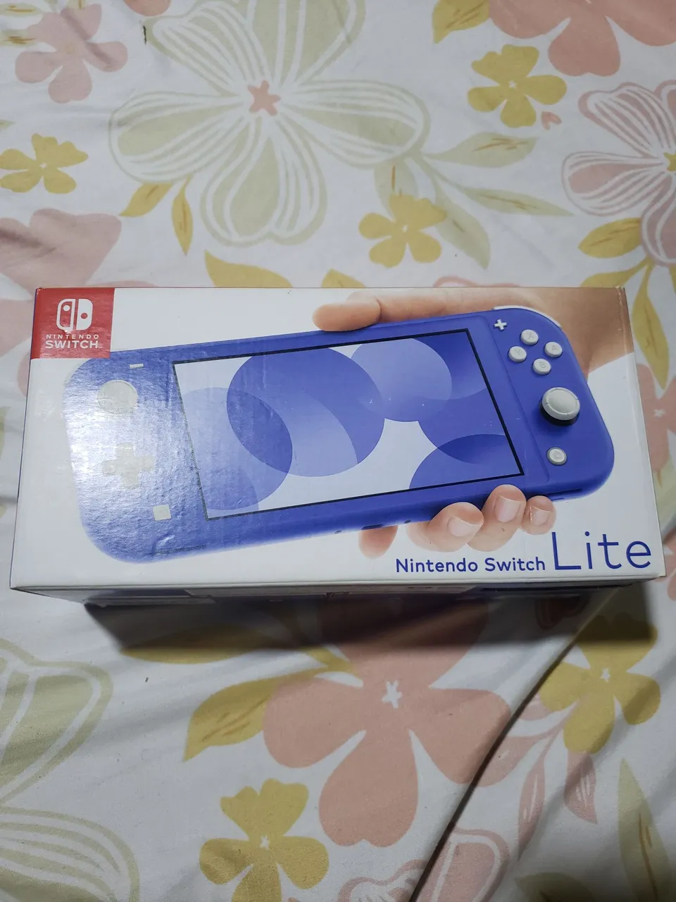 Vendo Nintendo switch lite azul semi novo + cartão sd 400gb