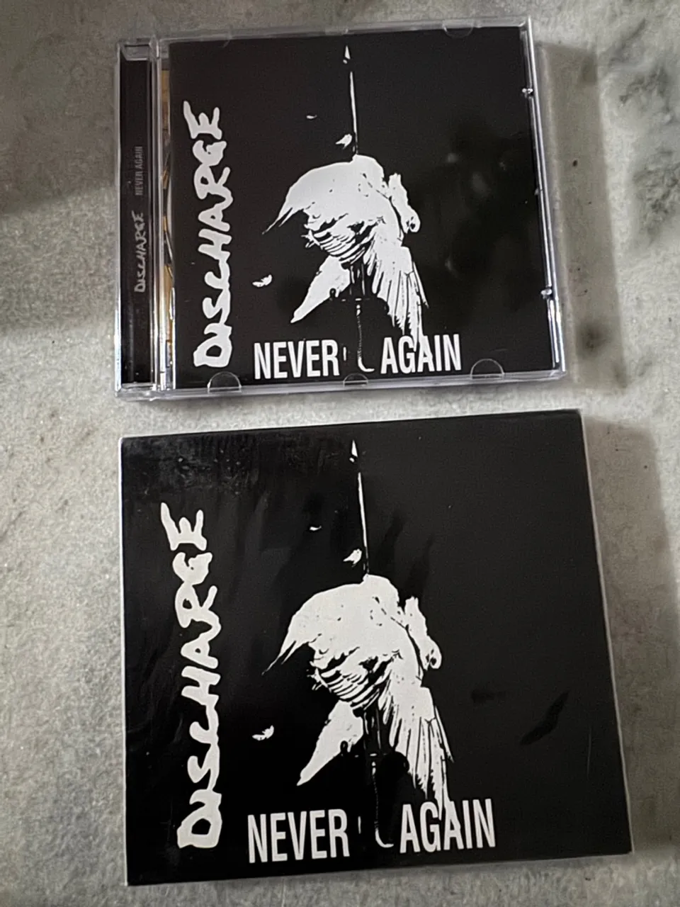 DISCHARGE - NEVER AGAIN - NOVO
