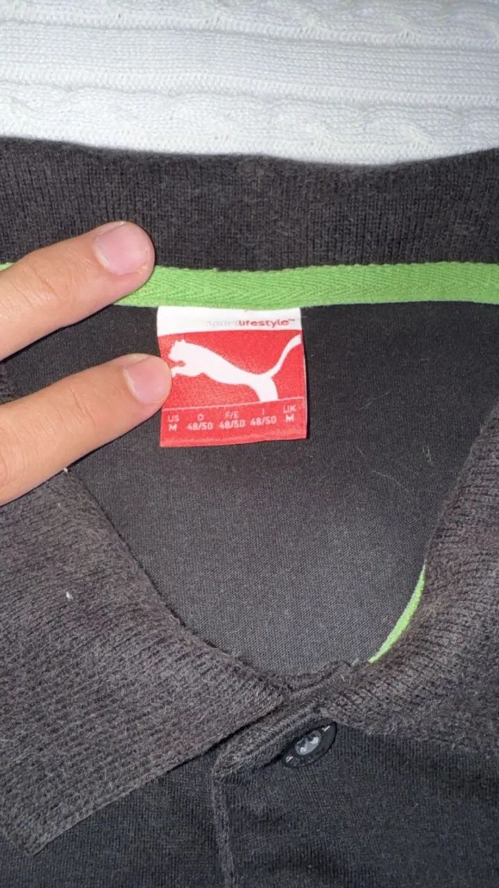 camisa polo listrada da Puma preta - Foto 4
