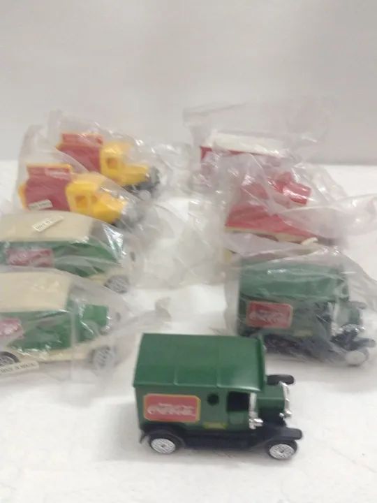 Lote de Caminhões da Coca Cola da década de 90 novos...