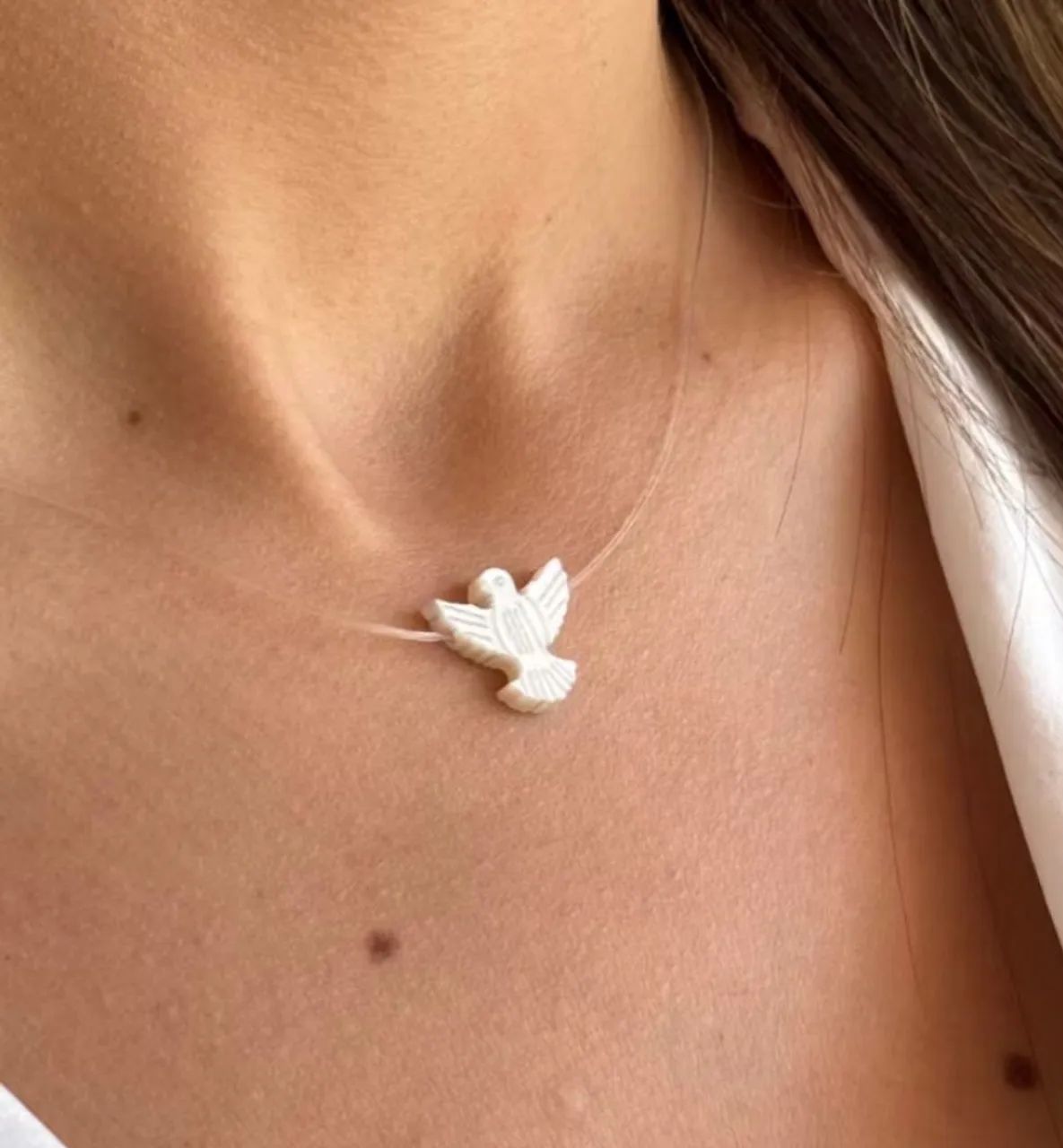 Pingente Espírito Santo no fio de nylon com ouro18k