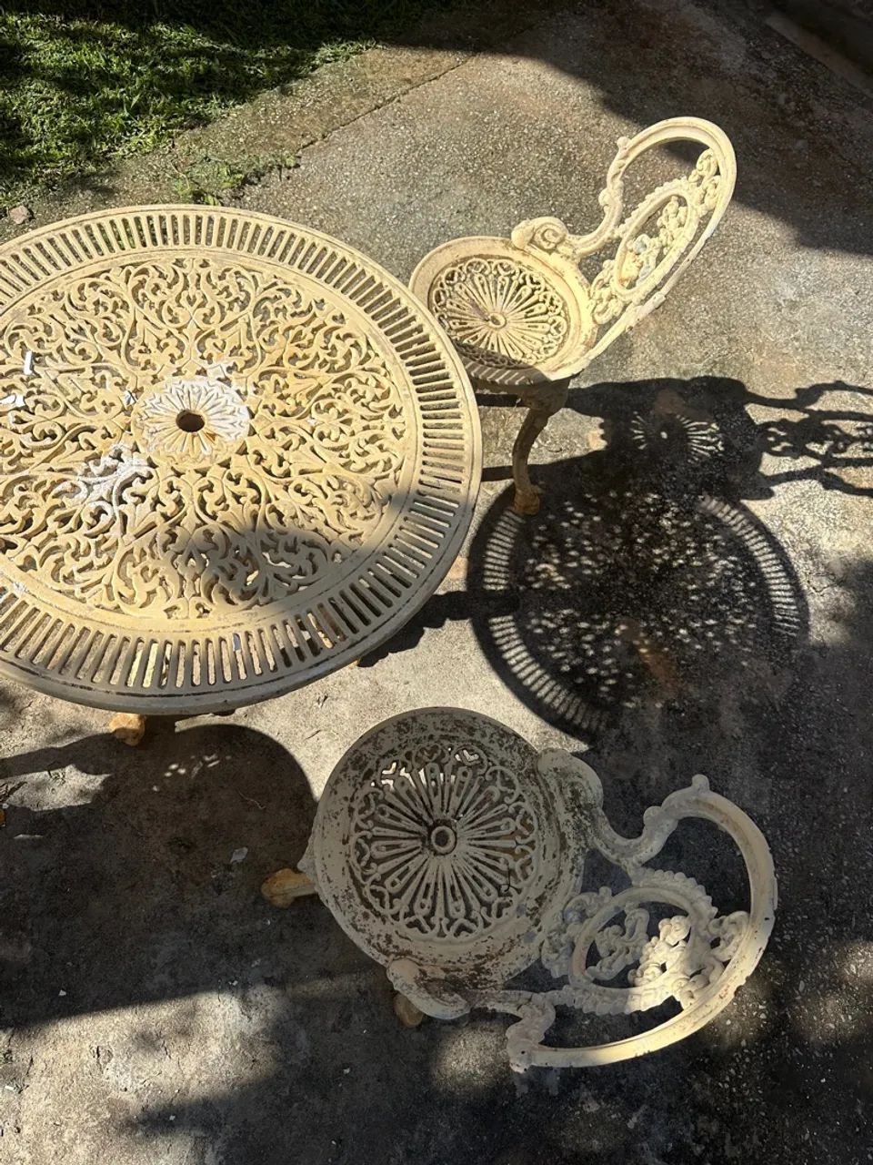 Cast iron chair and table set.