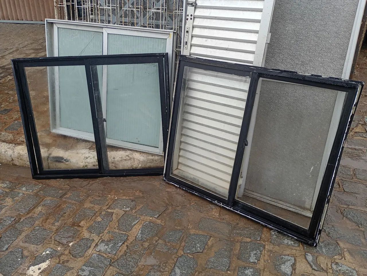 Black aluminum sliding window, width 1.20 m, height 1 m, unit price $450 ZAP *
