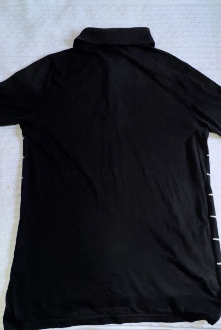 camisa polo listrada da Puma preta - Foto 3