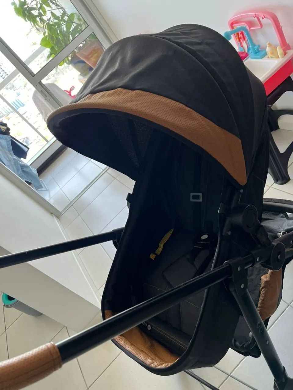 Carrinho com bebê conforto 