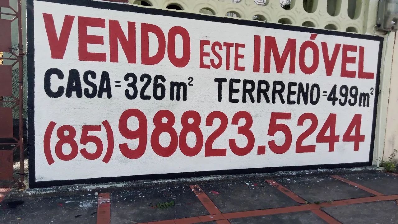 Pintor de letreiros em muros 