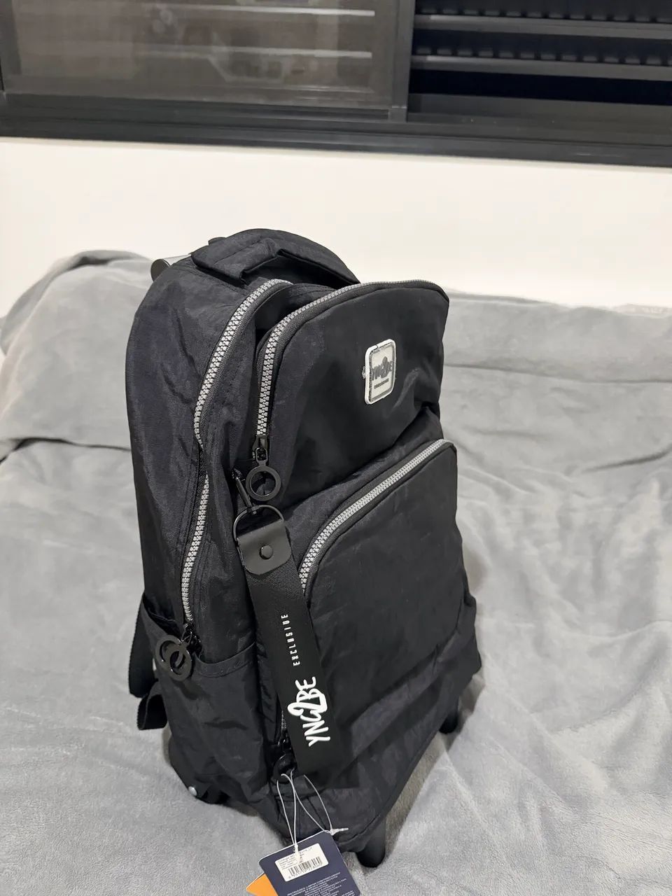 Mochila de costas e rodinha (360°)