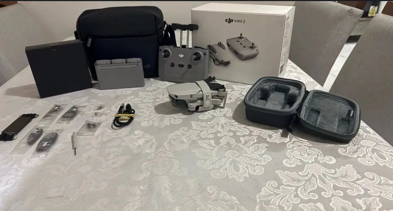 Drone DJI Mini 2 com combo fly more 3 baterias na caixa - Foto 4