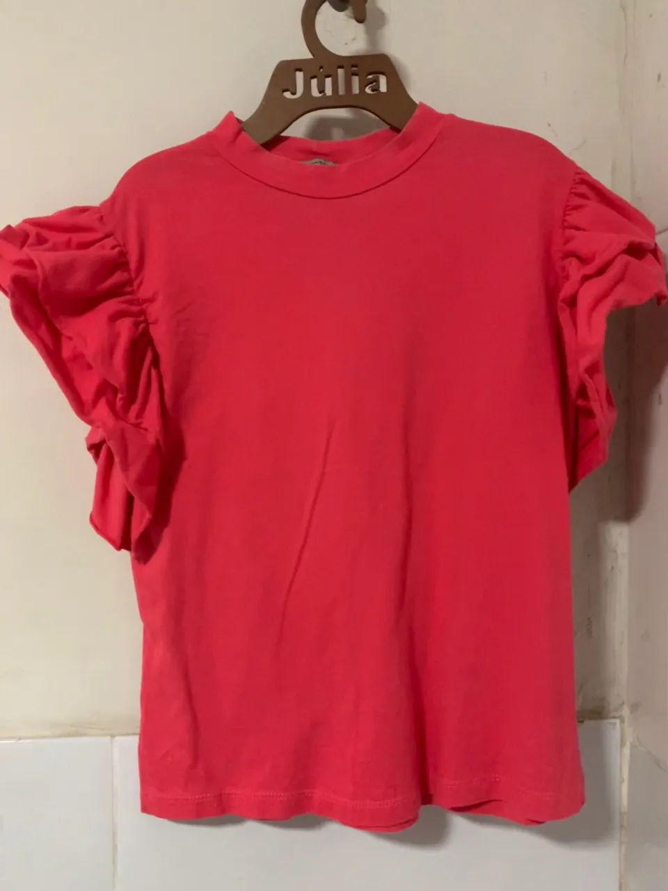 Blusa com detalhes nas mangas