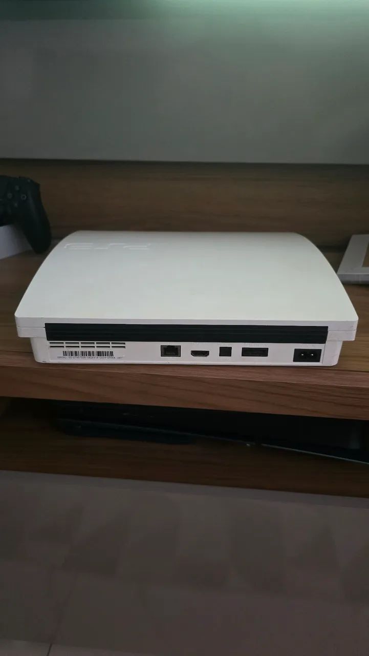 Ps3 slim branco 1 tera  - Foto 4