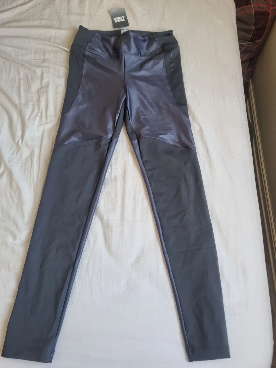 Legging recortes nova track field, p