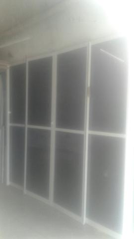 Porta de aluminio com vidro e pelicula semi nova tel.998604555