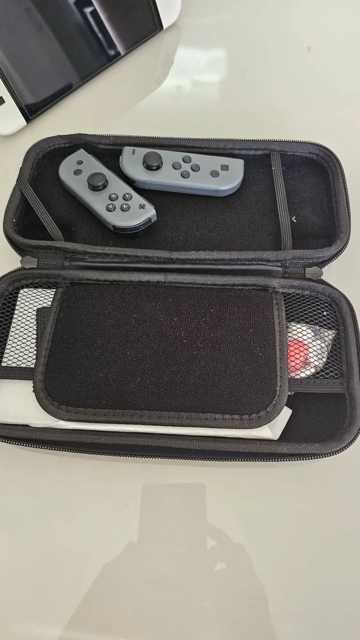 Nintendo Switch Oled m+ acessórios + jogos - Foto 4