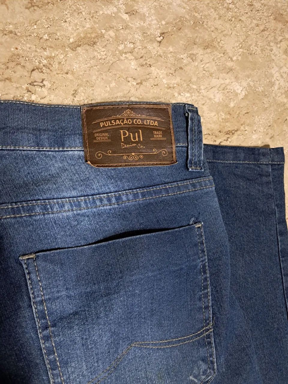 Calça jeans marca pulsação PUL