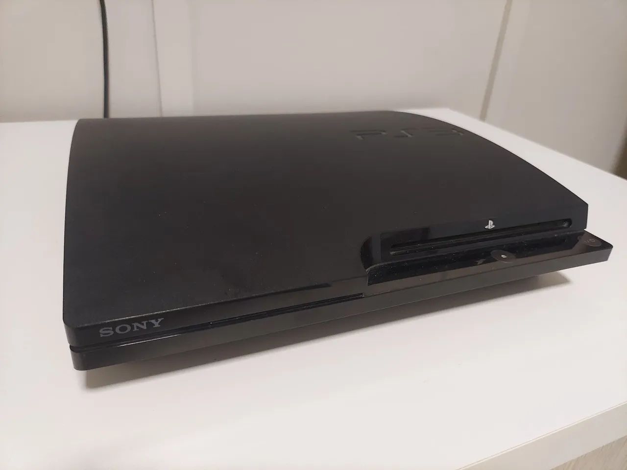 PS3 Slim 110V 1 controle e jogos 