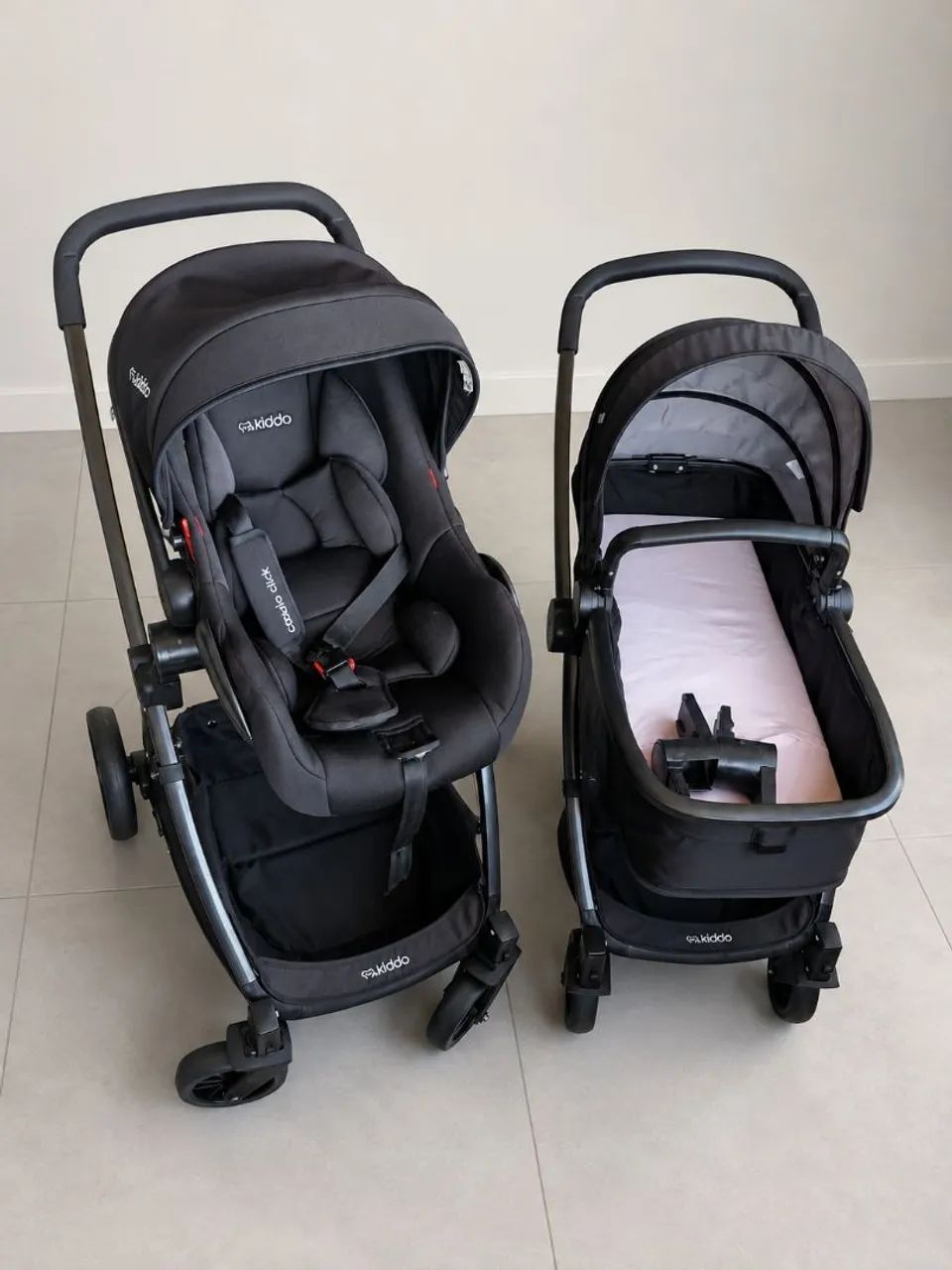 Carrinho de bebê com Moisés e bebê conforto Kiddo  