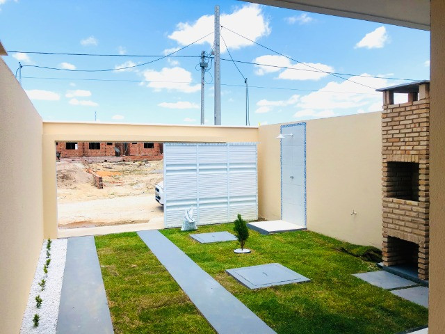 WS casa nova com 3 quartos,2 banheiros,coz.americana,quintal com otima localização - Foto 4