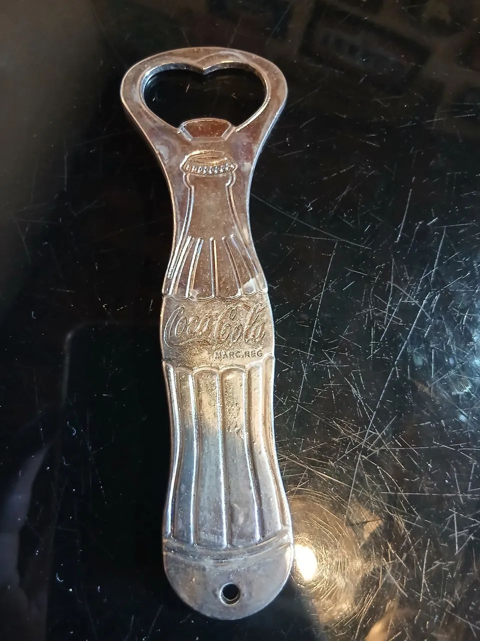 Abridor de garrafa coca cola