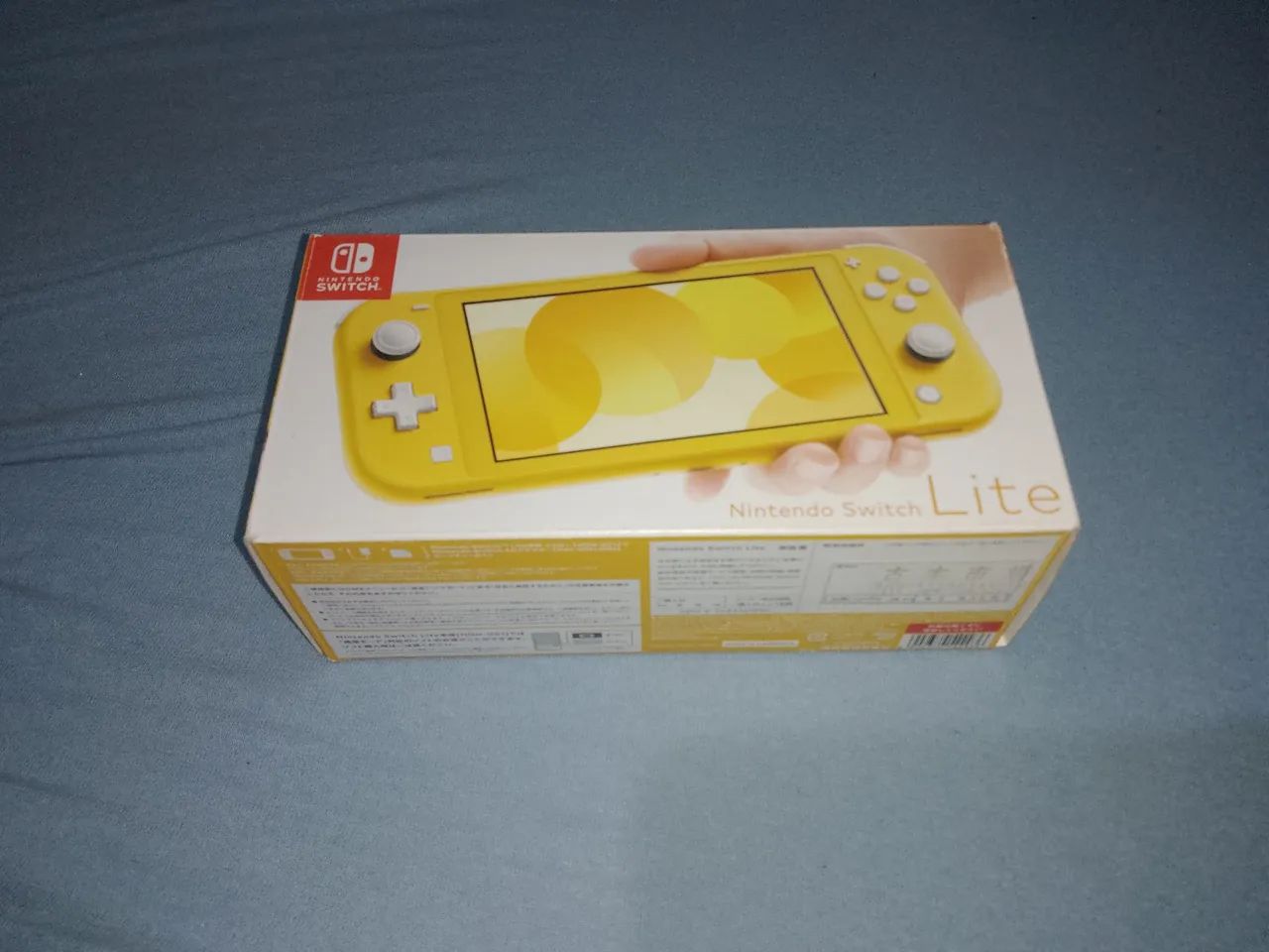 Nintendo Switch Lite Amarelo - Caixa vazia, berço, manual +
