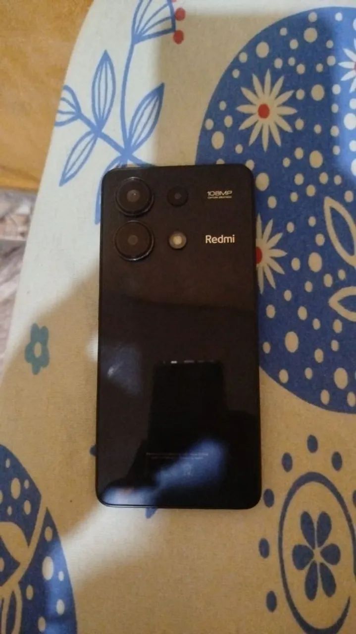 Vendo um celular redimi 12 em perfeito estado de uso sem aranhado funcionando 