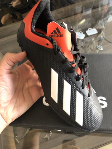 chuteira x18 society