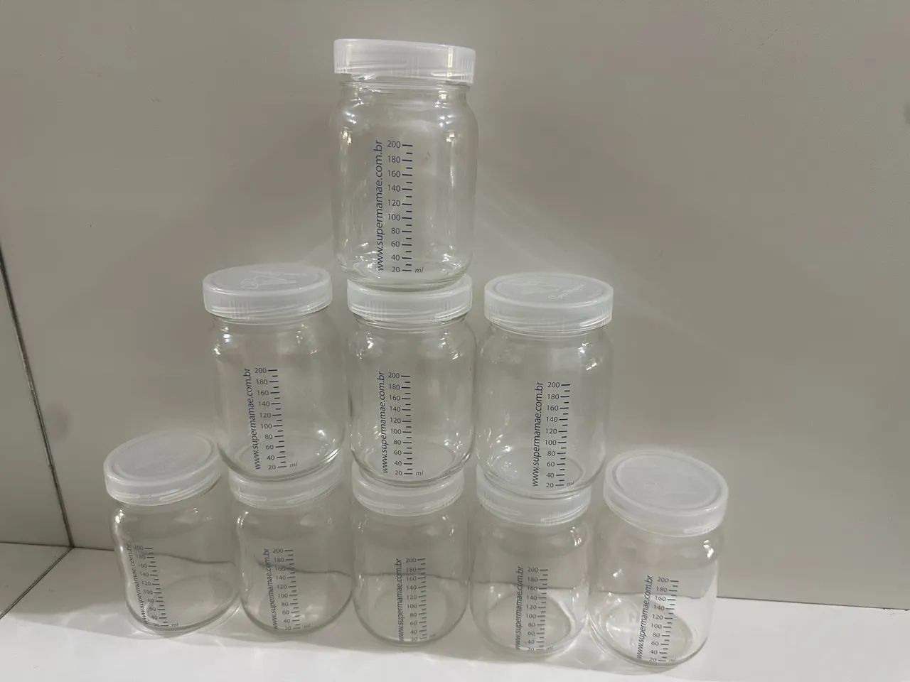 Kit com 9 potes de vidro para armazenar leite materno 200ml