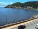 Sala living com vista frontal para o mar em são vicente sp