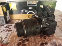 Título do anúncio: Câmera Profissional Nikon D3100 DSLR Zerada Usada Apenas pra Teste Acompanha Flash SB700