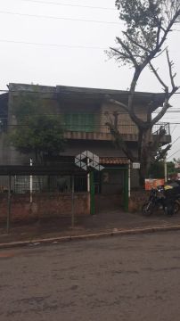 Prédio misto comercial/residencial com 2 apartamentos de 2 dormitórios