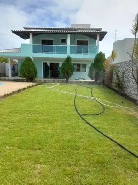 Aluguel casa 5/4, com 03 suítes, piscina, condominio fechado em Barra de jacuípe .