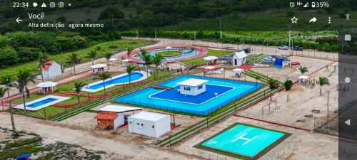 Vendo ou troco lote com acesso a área de lazer com piscina, campo de futebol e área verdeo