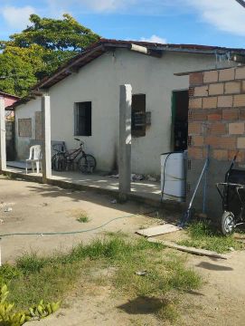 Terreno com casa em ótima localização