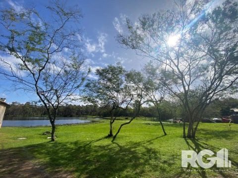 Sítio à venda no bairro Lami | Imóvel com 5,9HA, conta com extenso açude, galpão com churr