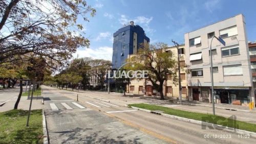Apartamento Jk, cozinha, área de serviço e banheiro solcial.