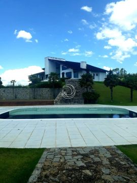 Casa de condomínio para venda possui 400 metros quadrados com 7 quartos